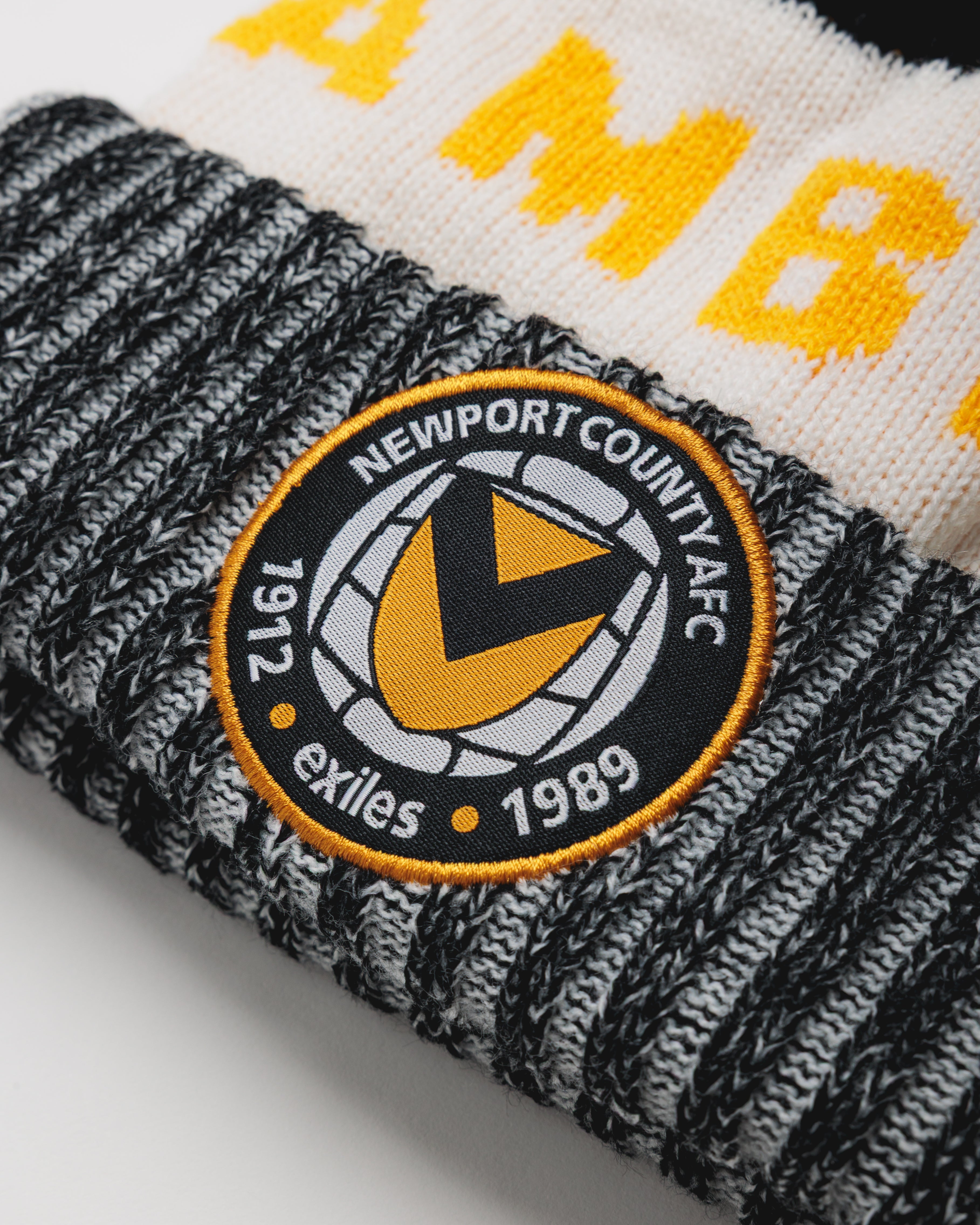 Newport County AFC 24/25 Bobble Hat- Black/White/Amber