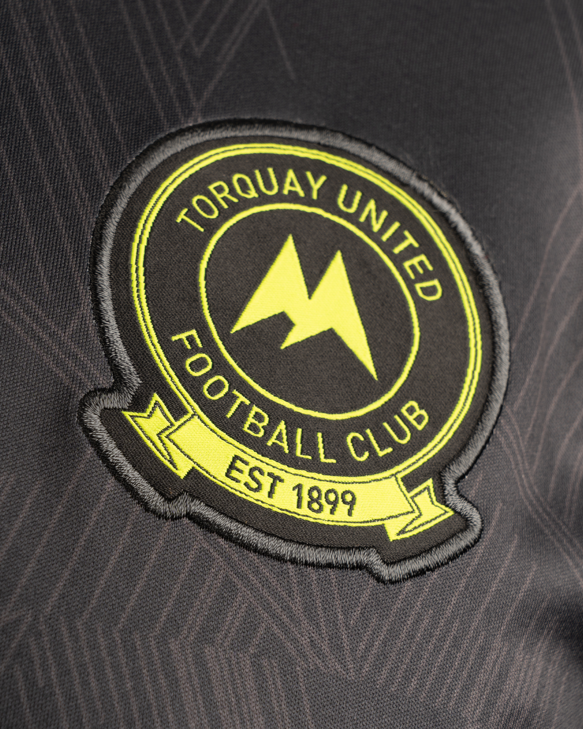 Torquay United FC 25/26 Vertex Training Tee Youth	Charcoal/Light Grey/Fluro Yellow