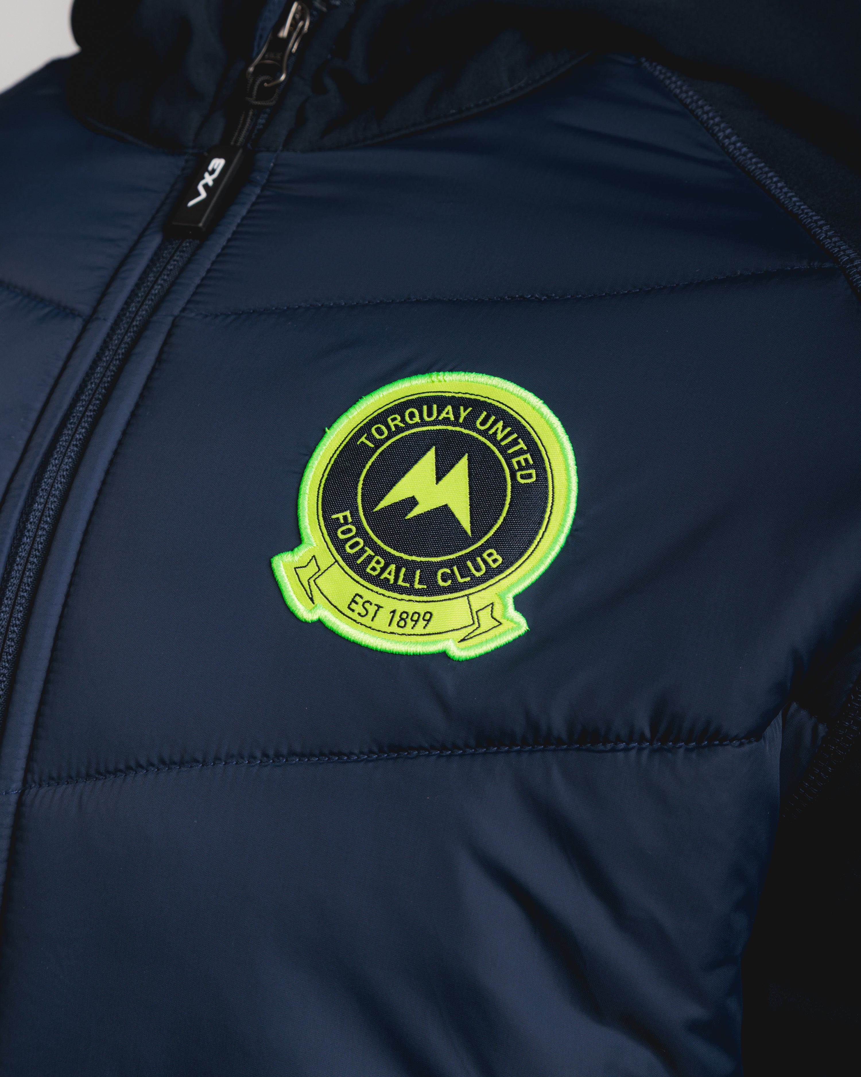Torquay United FC 25/26 Tempest Hybrid Jacket Navy/Fluro Yellow