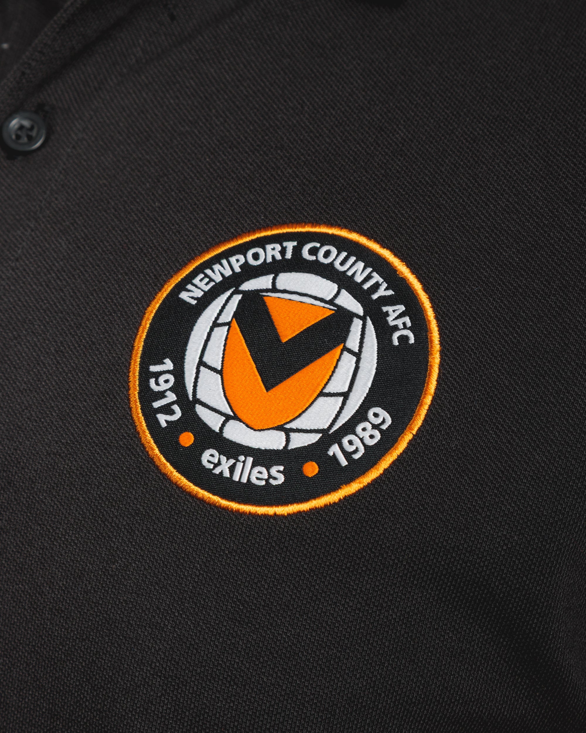 Newport County AFC 25/26 Primus Polo Shirt Black/Amber