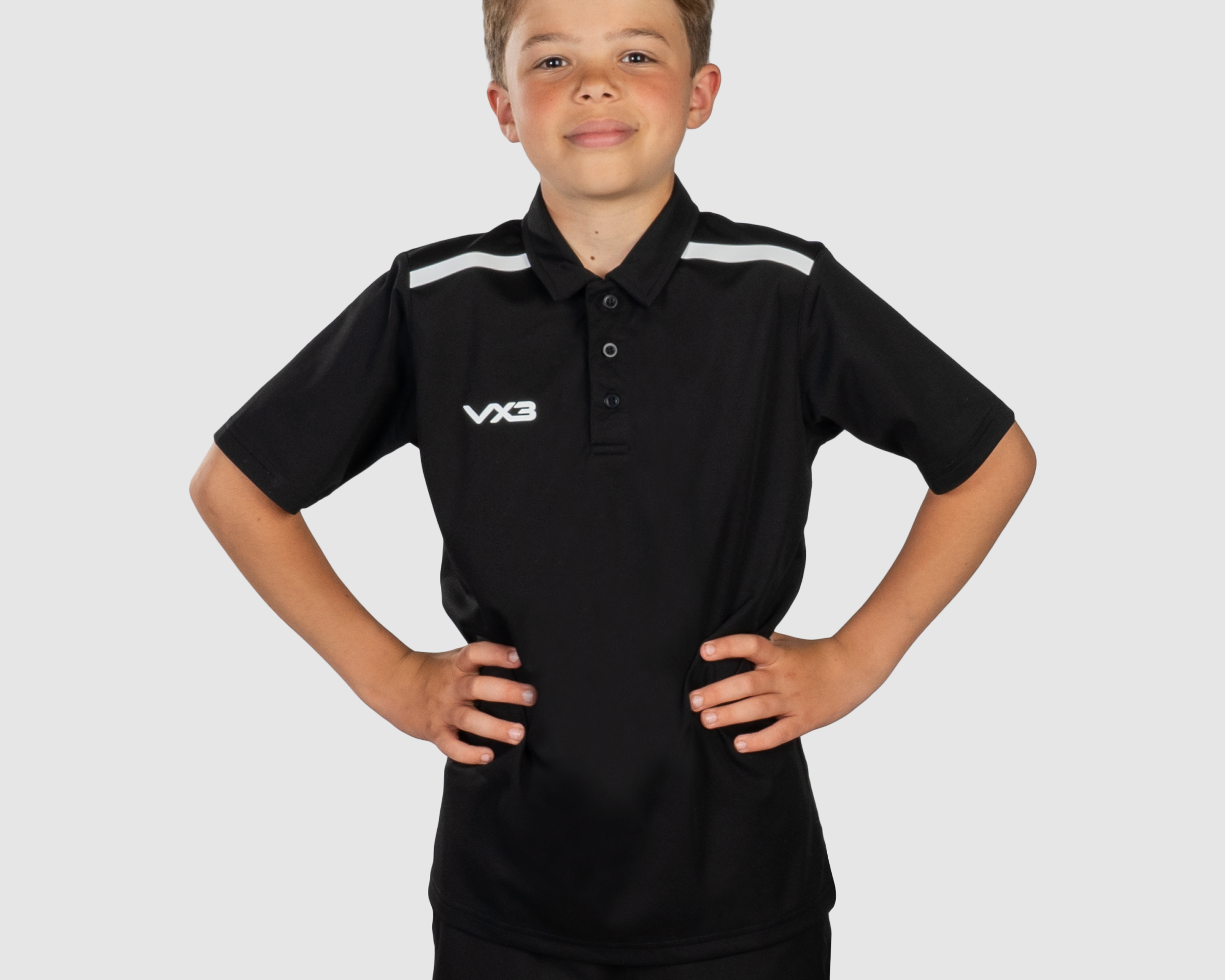 YouthFortisPoloBlackWhiteFront.png