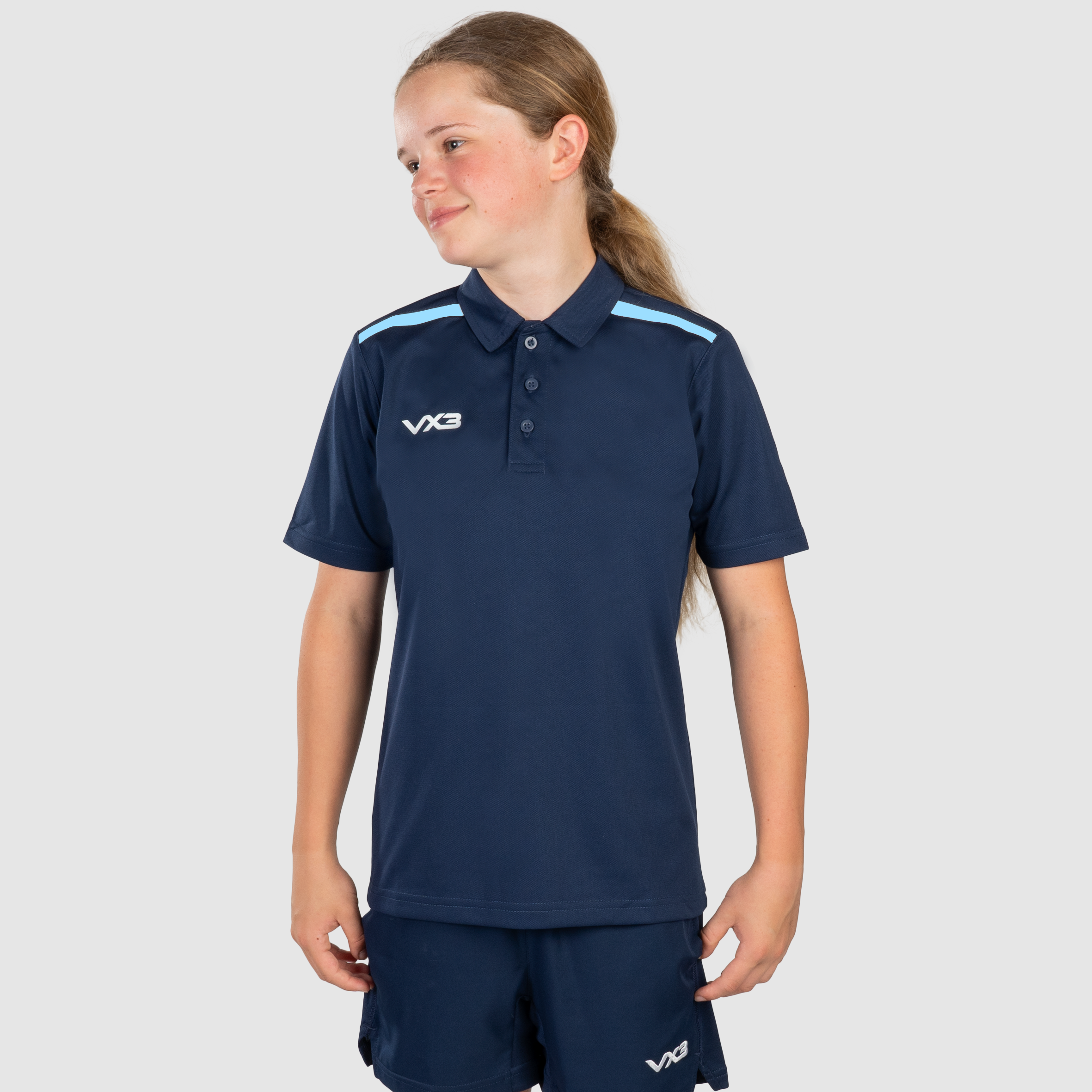 FortisYouthPoloNavy_SkyFront_d07bdd07-da75-47e8-a3f9-aac033e7f08e.png