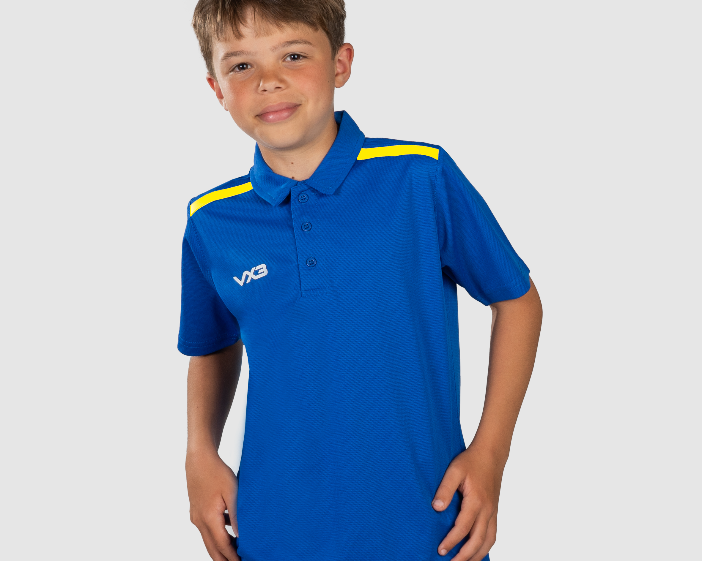FortisYouthPoloRoyal_YellowFront.png