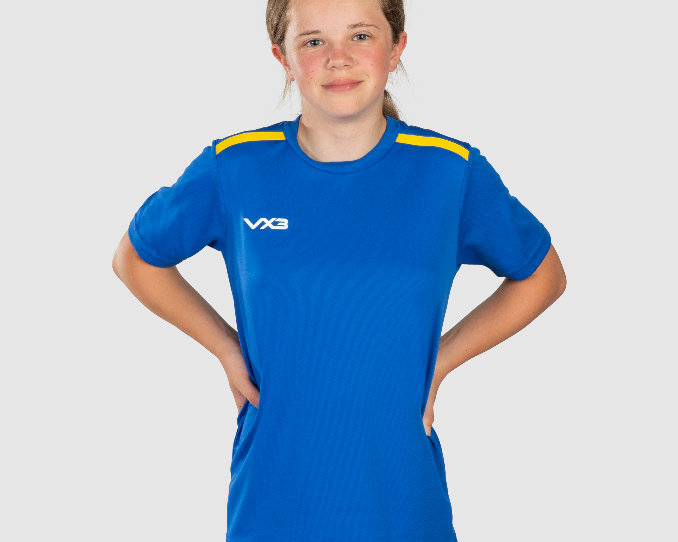 FortisYouthTeeRoyal_YellowFront.png