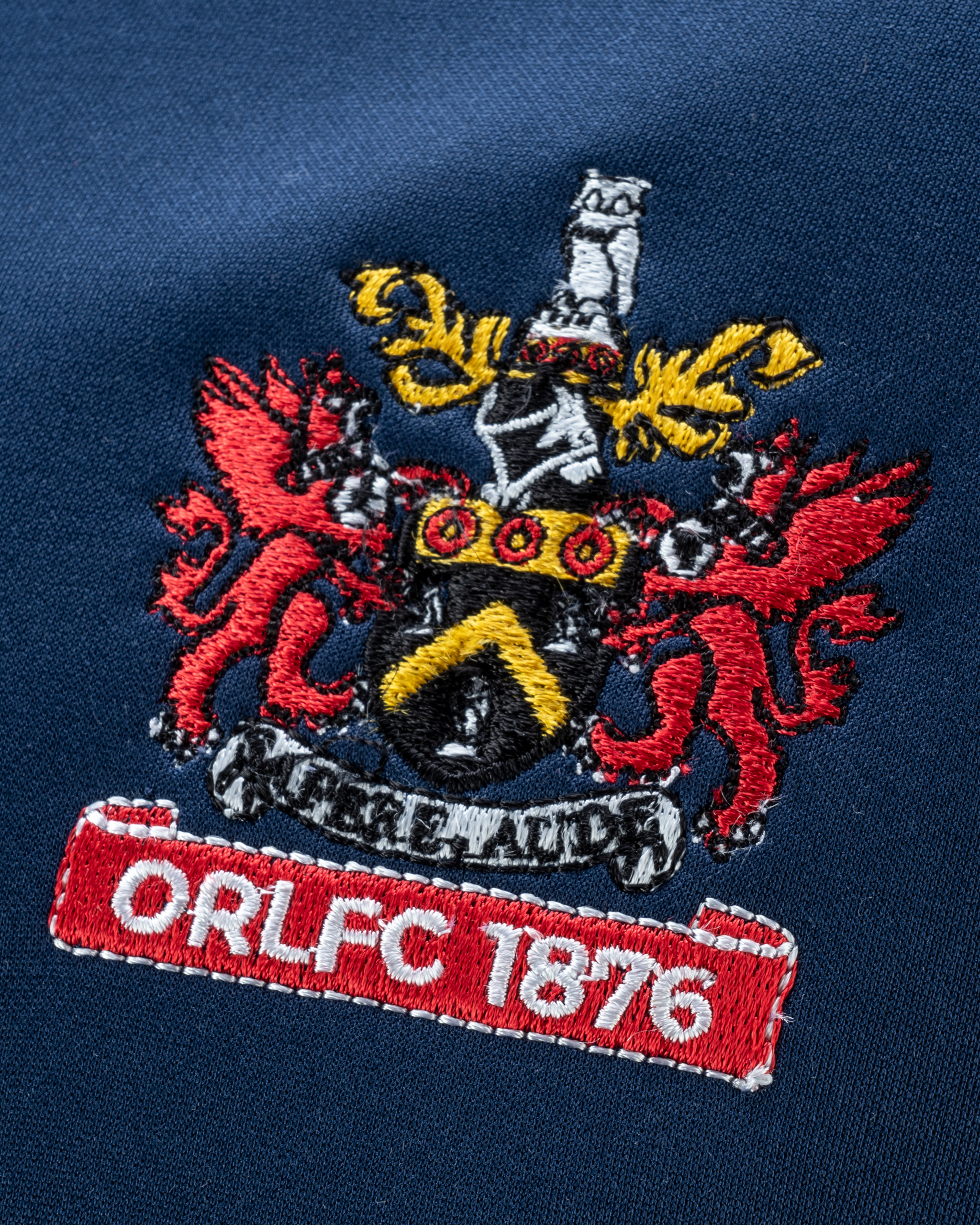 Oldham RLFC 2025 Quadrigo Training Sweatshirt Navy/Red Youth