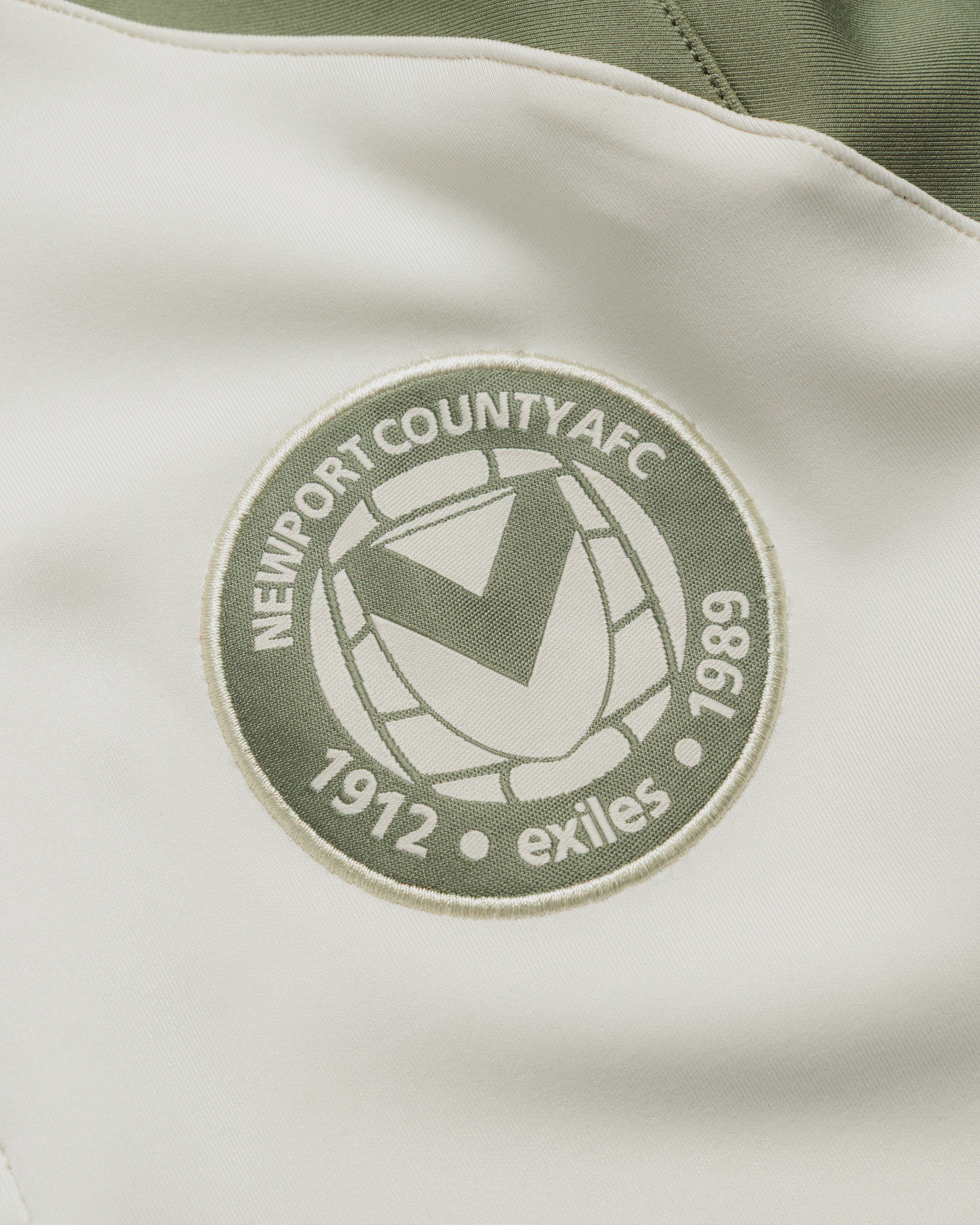 Newport County AFC 26/27 Vertex Half Zip Top Youth Ecru/Dark Olive
