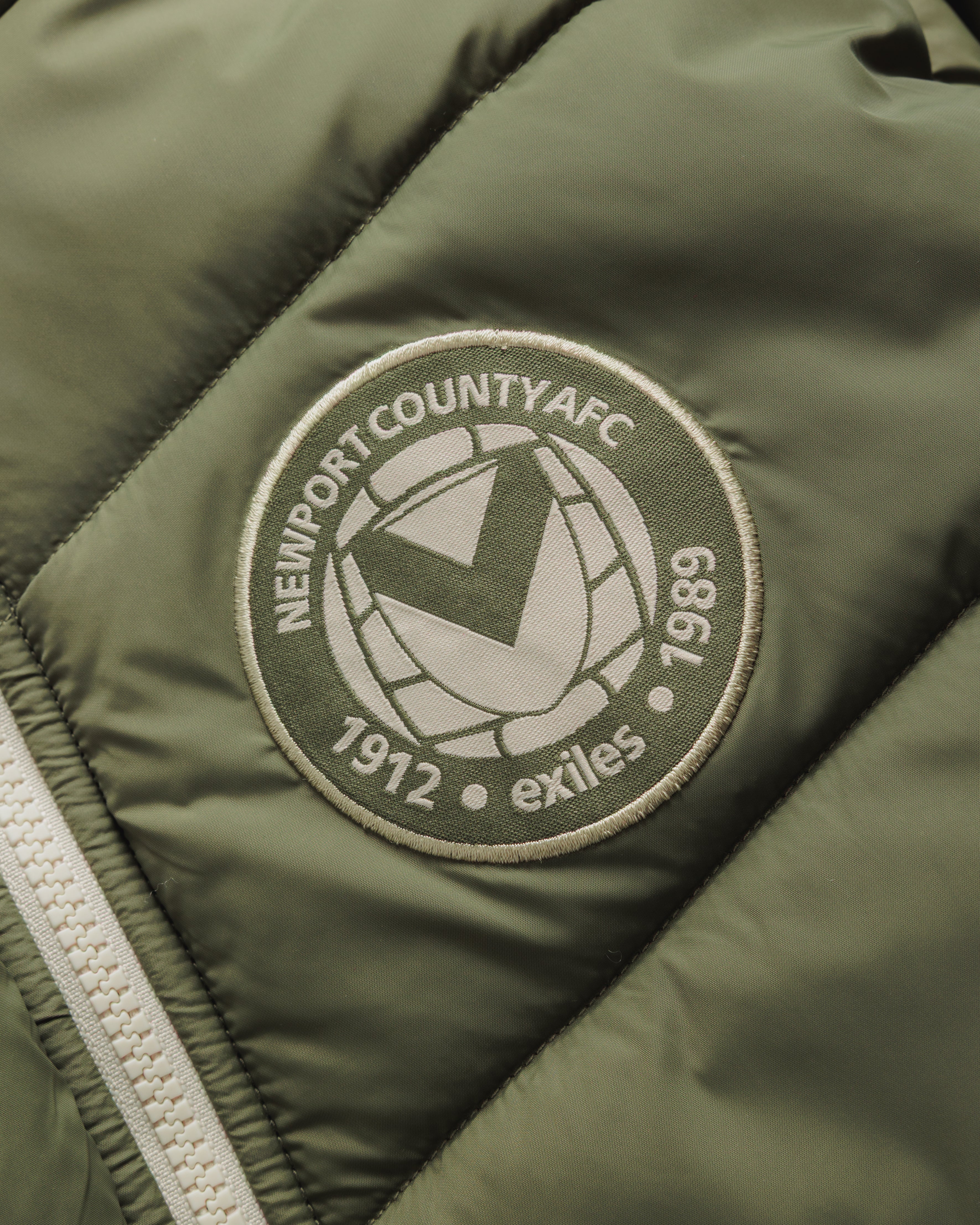 Newport County AFC 26/27 Lorica Jacket Youth Dark Olive/Ecru