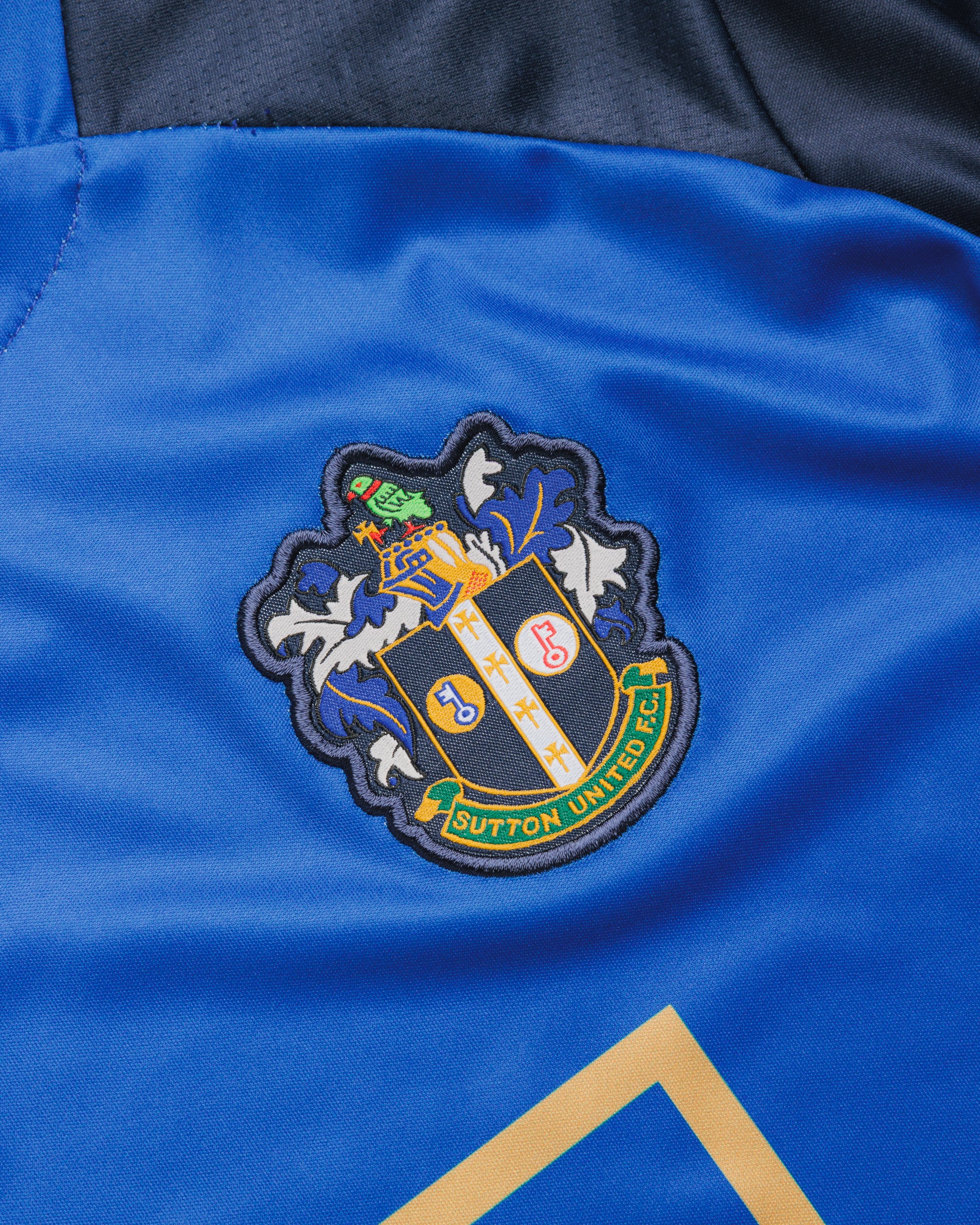 Sutton United 26/27 Vertex Training Tee Youth Royal/Navy/Gold