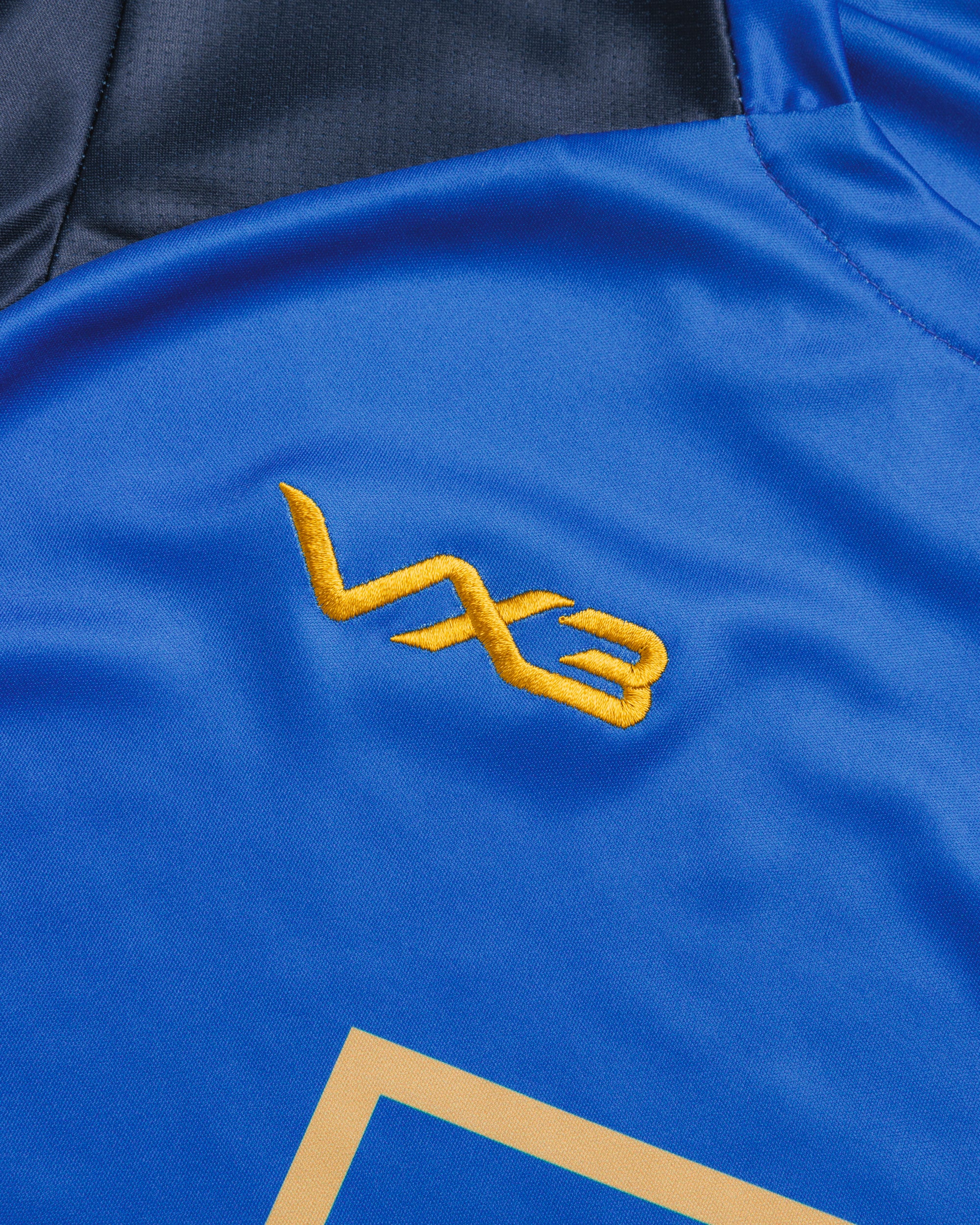 Sutton United 26/27 Vertex Training Tee Youth Royal/Navy/Gold