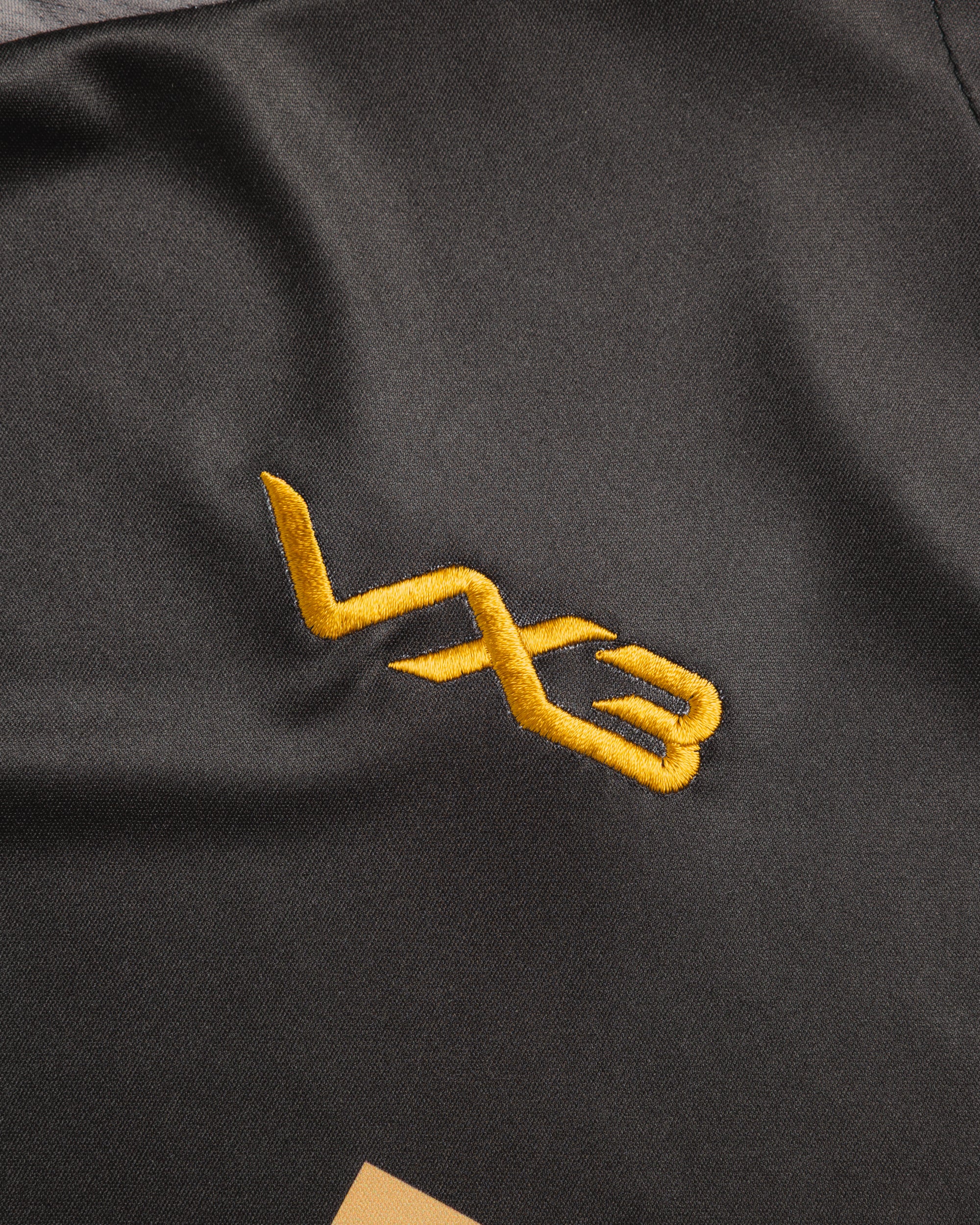 Sutton United 26/27 Vertex Training Tee Black/Dark Grey/Gold