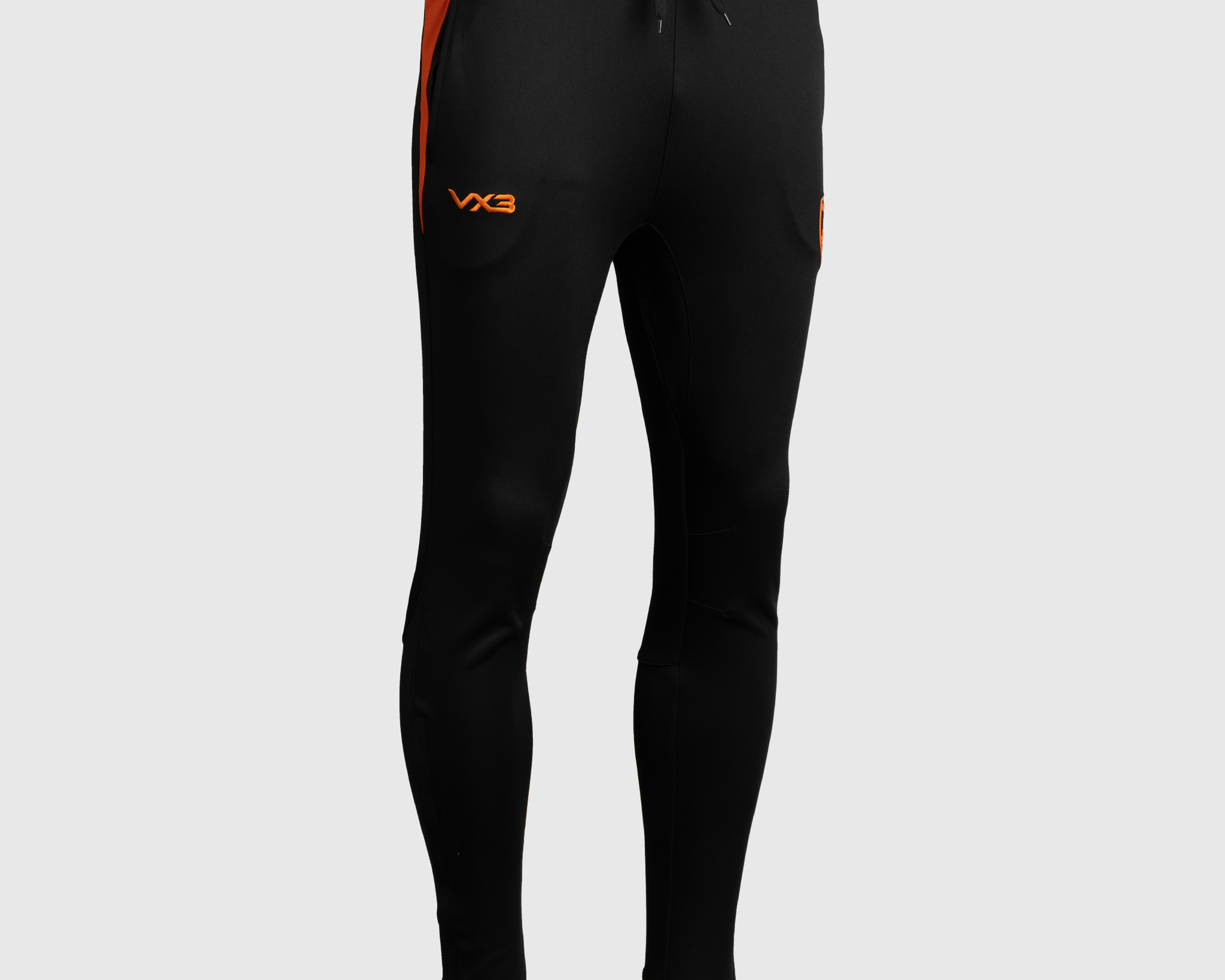 P74531-DRAGONS-RFC-25-26-VERTEX-SKINNY-PANTS-YOUTH-BLACK-BRIGHT-ORANGE-ALT1.png