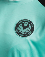 Newport County AFC 25/26 Vertex Training Tee  Youth Aruba/Blue Coral