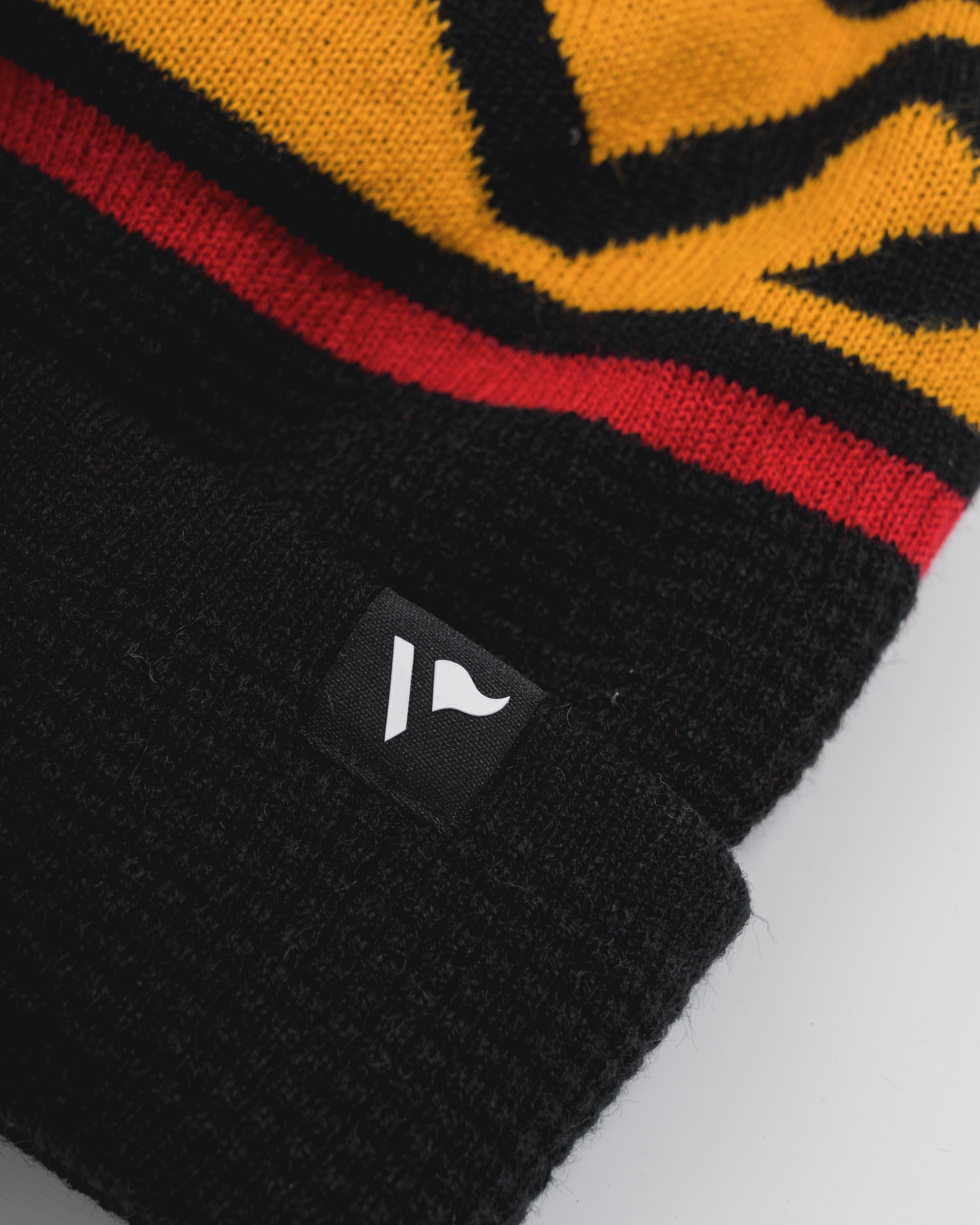 Waffle Knit Bobble Hat - Black/Amber/Red