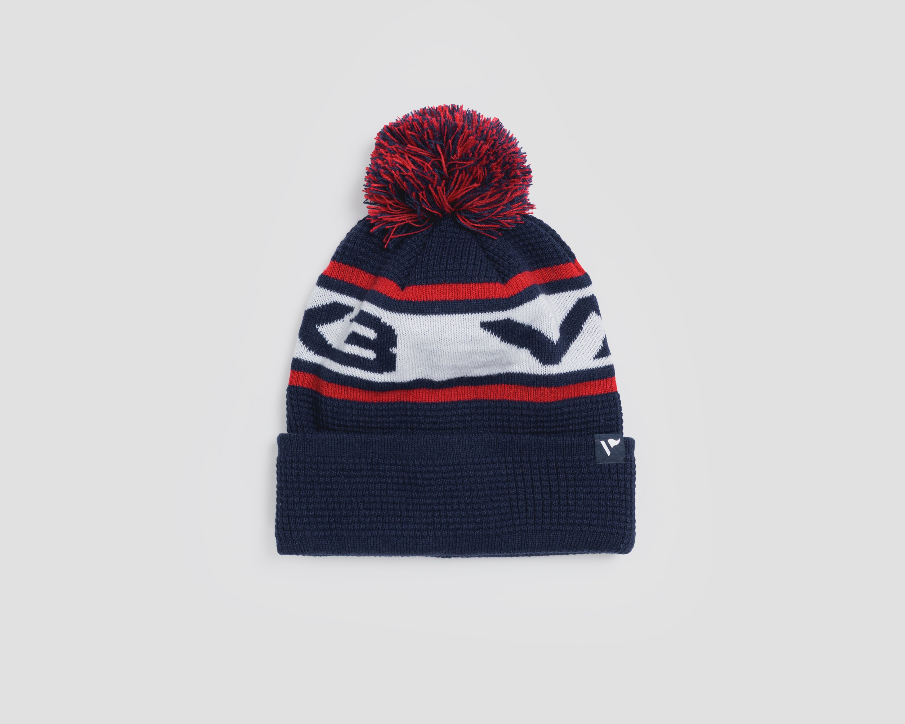 P83990WaffleKnitBobbleHat-Navy-Red-White-1_431532b4-f3d1-4769-8416-cb5765e3c8f6.jpg
