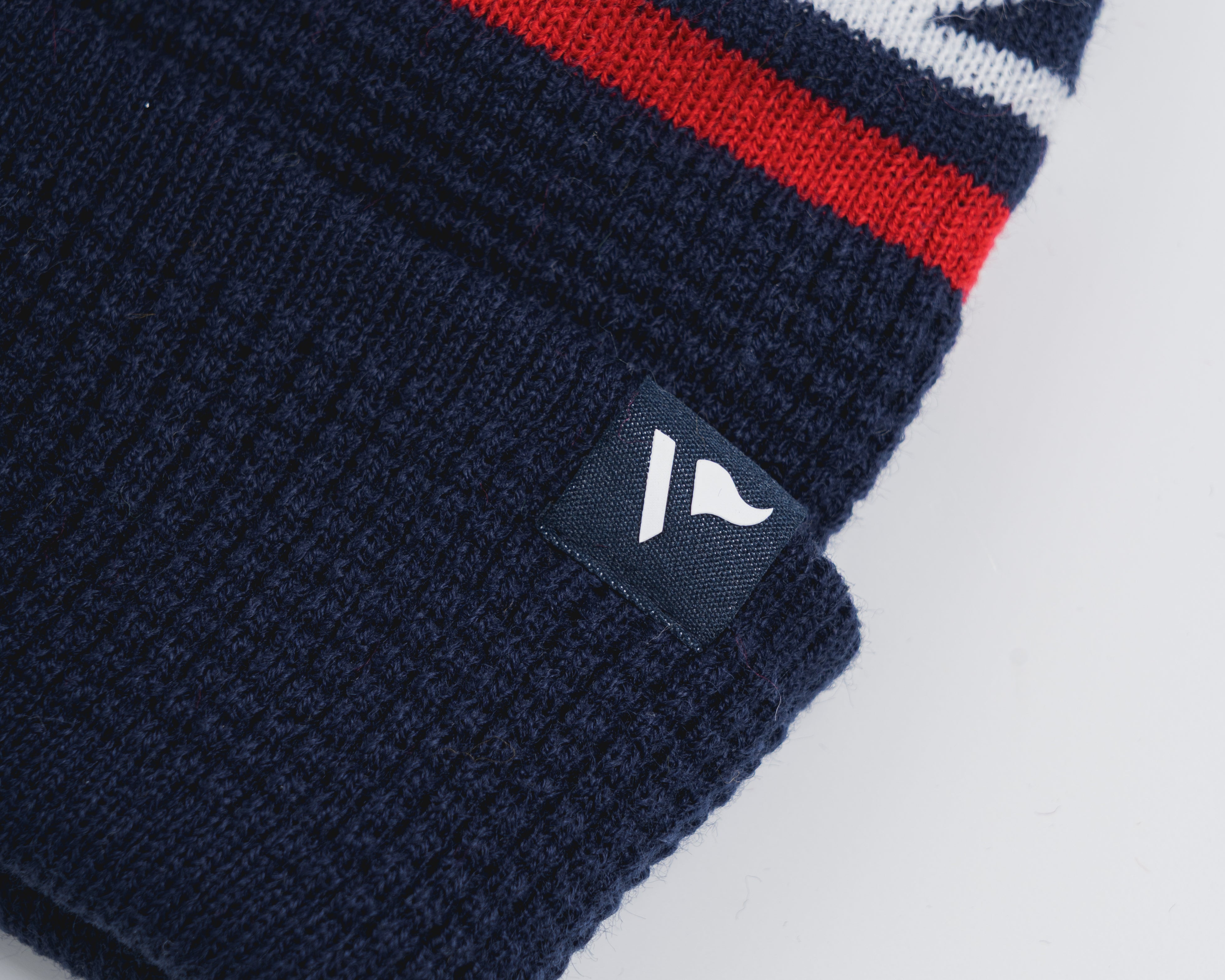 P83990WaffleKnitBobbleHat-Navy-Red-White-2.jpg