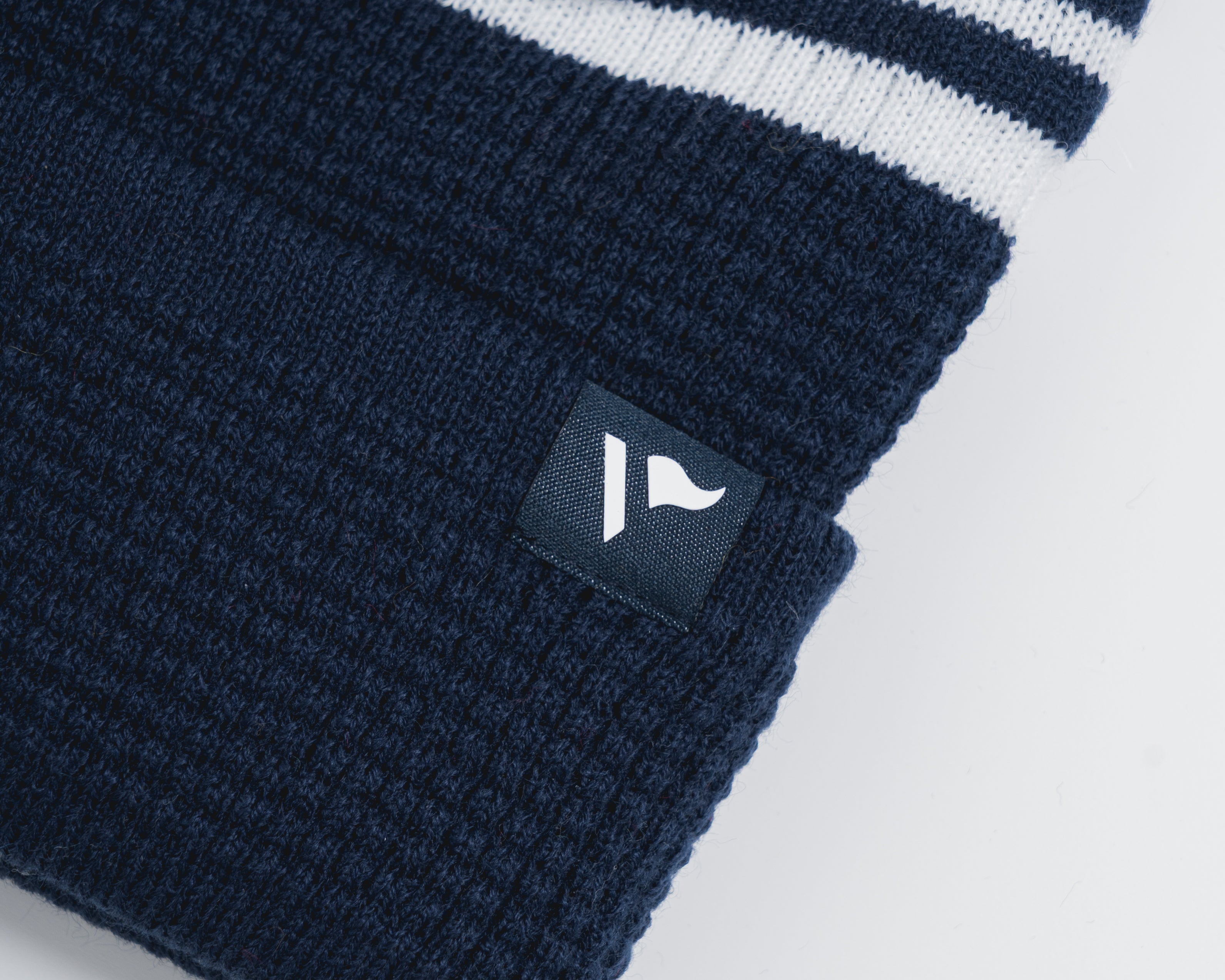 P83991WaffleKnitBobbleHat-Navy-White-2.jpg