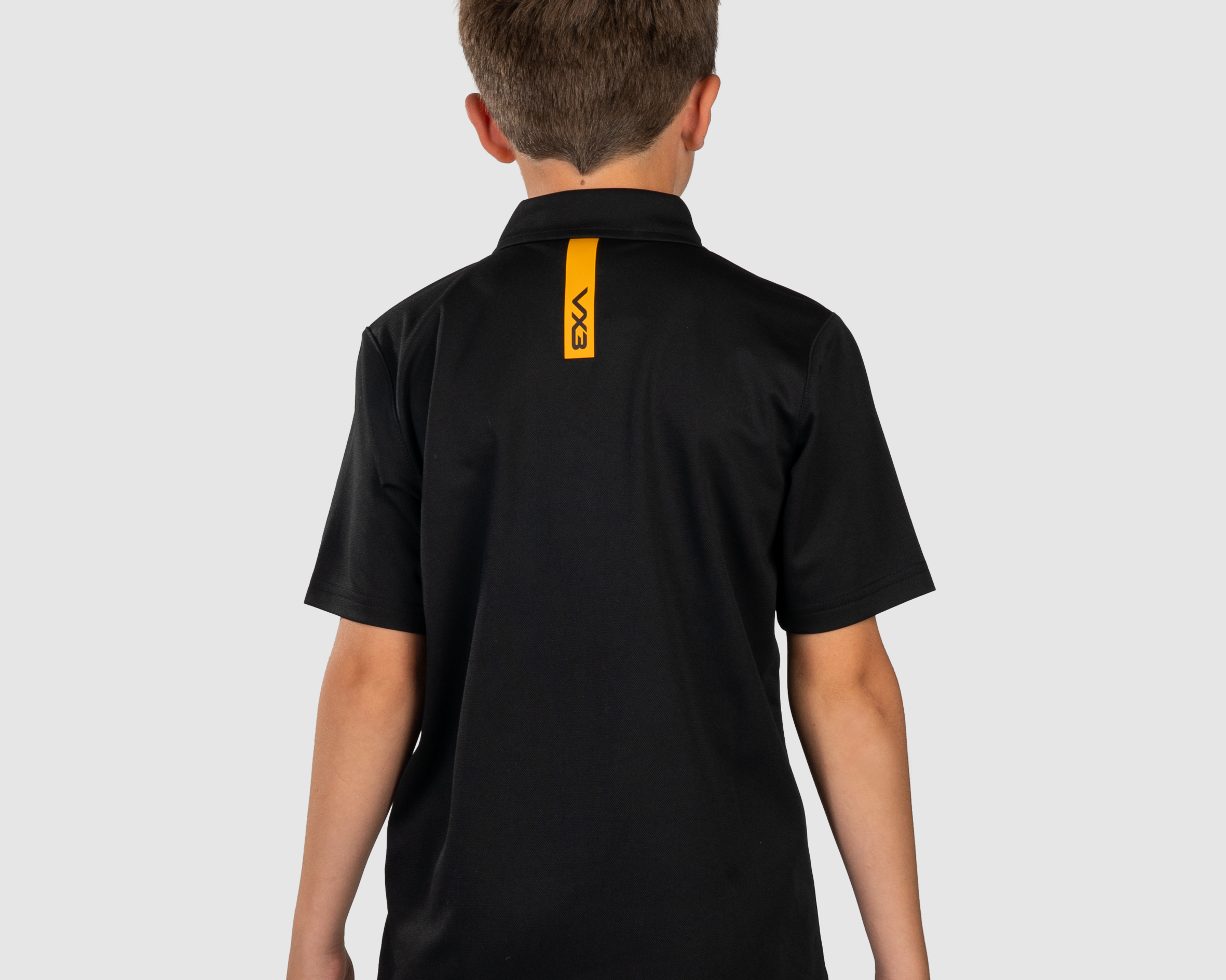 YouthFortisPoloBlackAmberBack.png