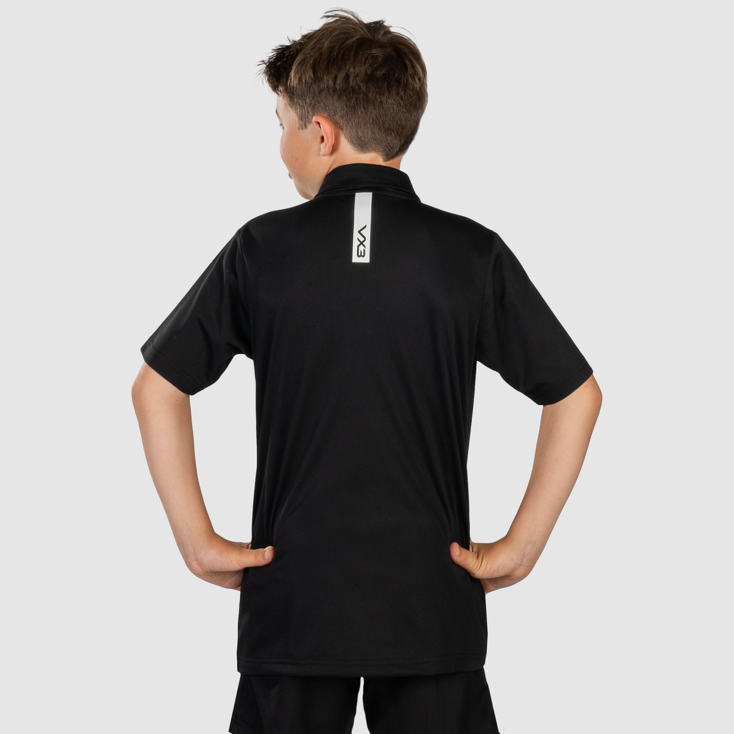 YouthFortisPoloBlackWhiteBack.png
